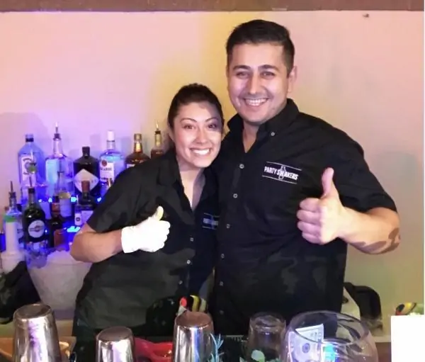 Sean and Brenda behind a full set up bar | Party Shakers bartending services