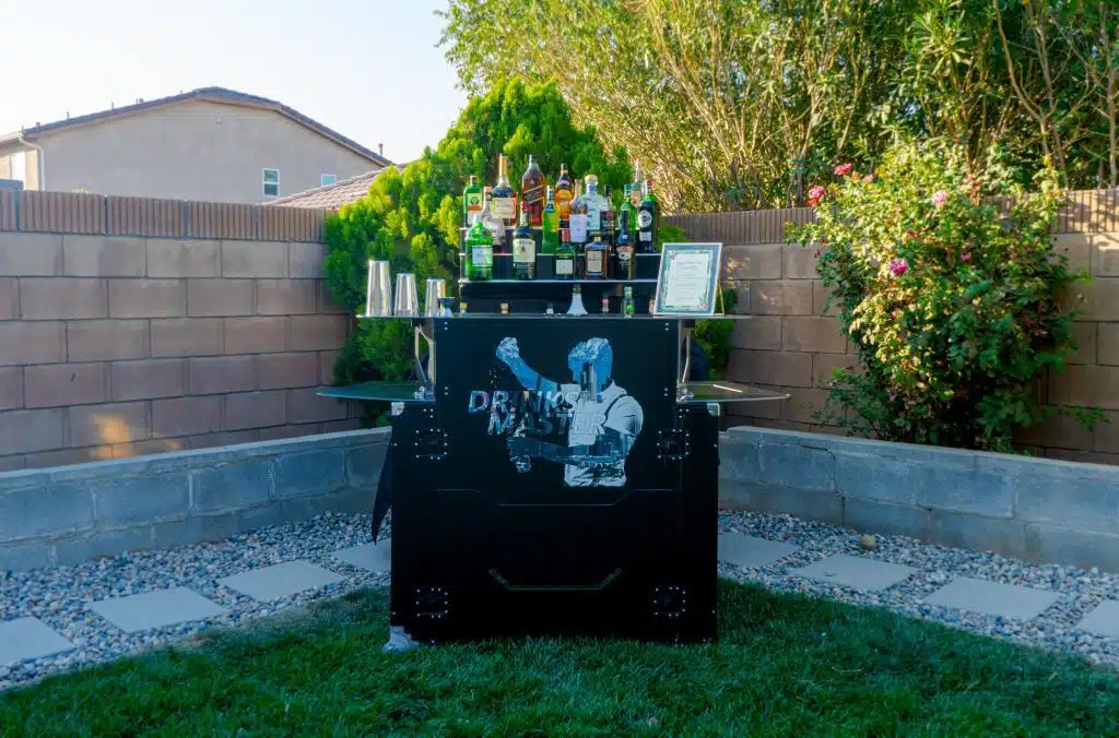 a black bar set up for bar rentals. The bars has an open bar package.bartending obsolete